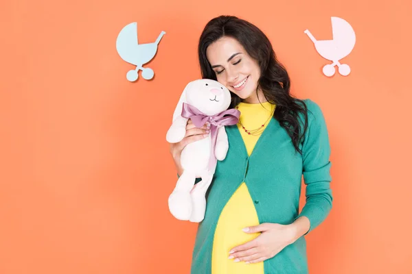 Beautiful Pregnant Woman Smiling Closed Eyes Holding Toy Rabbit Orange — Stock Photo, Image