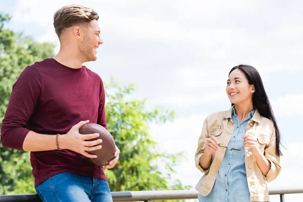 Cheerful Young Woman Looking Man American Football Hands — Stock Photo, Image