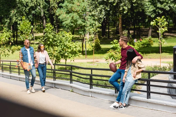 Selective Focus Happy African American Man Holding Longboard Walking Girl — Stock Photo, Image