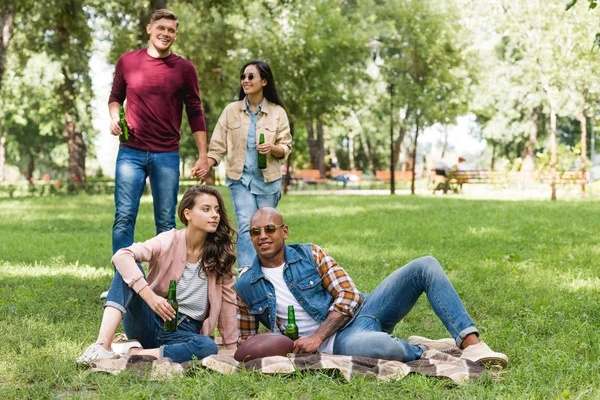 Cheerful African American Young Man Pretty Girl Sitting Blanket Bottles — Stock Photo, Image