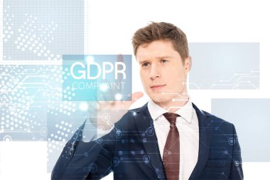 successful businessman in suit pointing with finger at gdpr compliant illustration on white background clipart