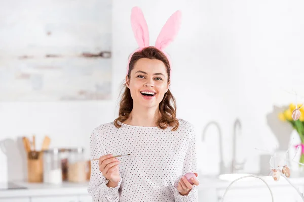 Laughing Curly Woman Bunny Ears Painting Easter Egg Kitchen — Stock Photo, Image