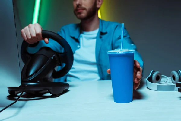 Selective Focus Young Adult Man Holding Paper Cup Playing Video — Stock Photo, Image