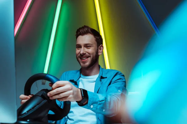 Selective Focus Handsome Smiling Man Playing Video Game Steering Wheel — Stock Photo, Image