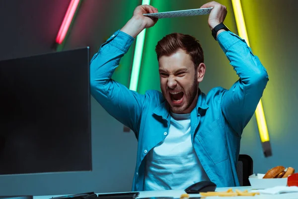 Handsome Angry Man Holding Computer Keyboard Screaming — Stock Photo, Image