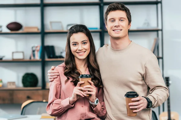 Two Smiling Friends Holding Paper Cups Coffee Looking Camera — Stock Photo, Image