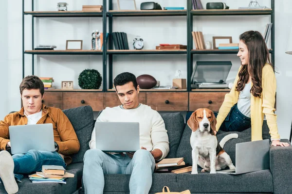 Three Cheerful Multicultural Students Sitting Sofa Uisng Laptops Home — Stock Photo, Image