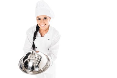 Chef in hat holding tray with cloche isolated on white clipart