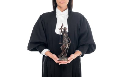Partial view of judge in judicial robe holding themis figurine isolated on white clipart