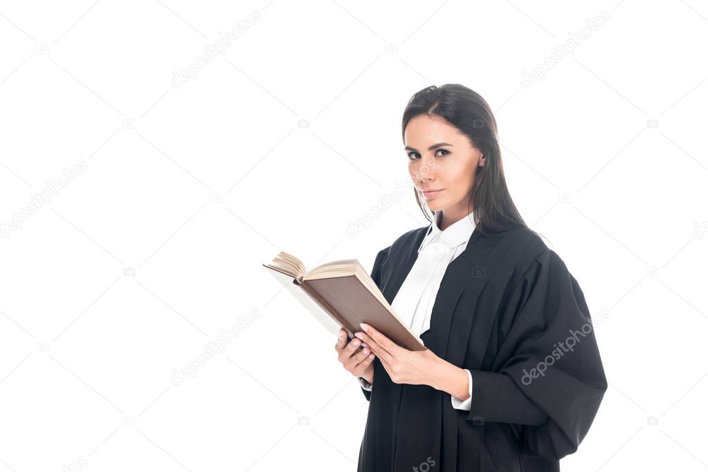 Judge in judicial robe reading book isolated on white