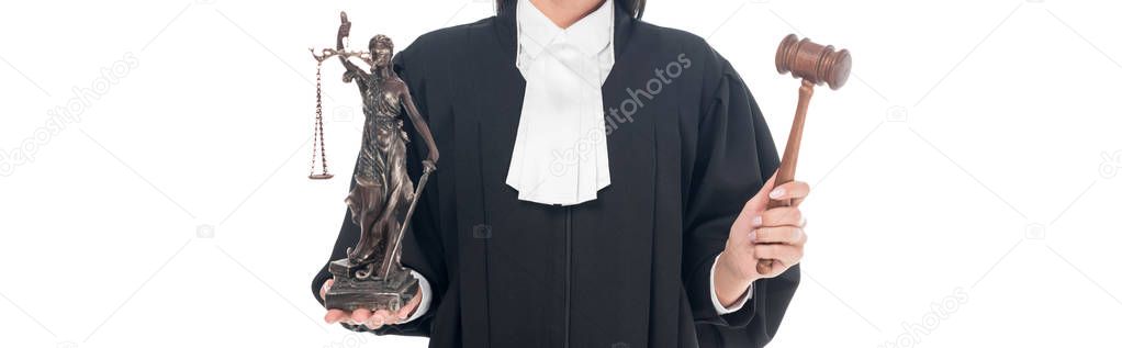 Panoramic shot of judge in judicial robe holding gavel and themis figurine isolated on white