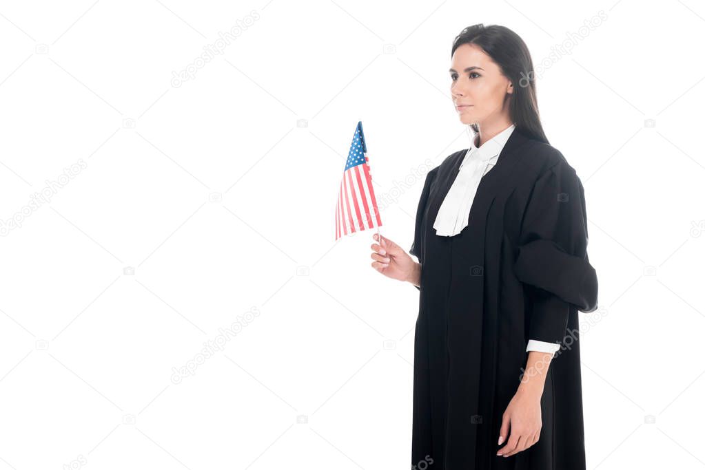 Judge in judicial robe holding american flag isolated on white