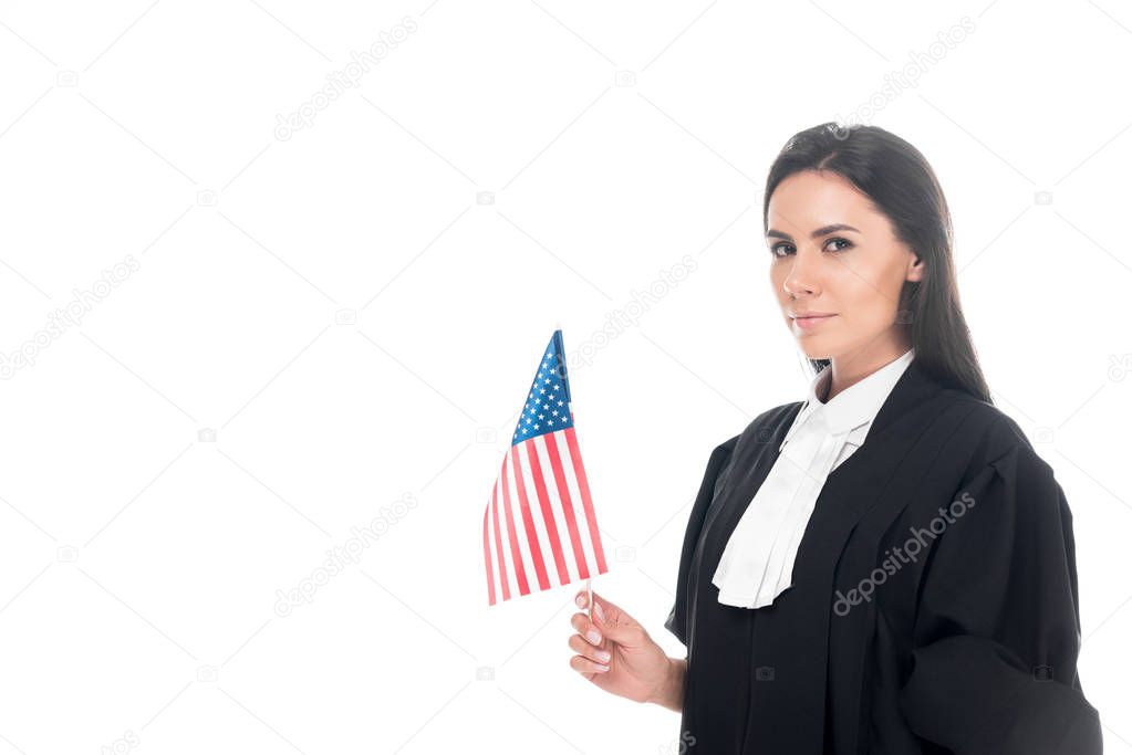 Judge in judicial robe holding american flag isolated on white