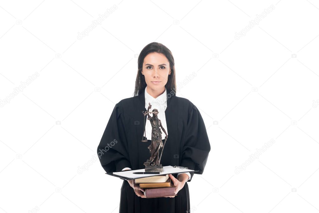 Judge in judicial robe holding themis figurine, books and clipboard isolated on white