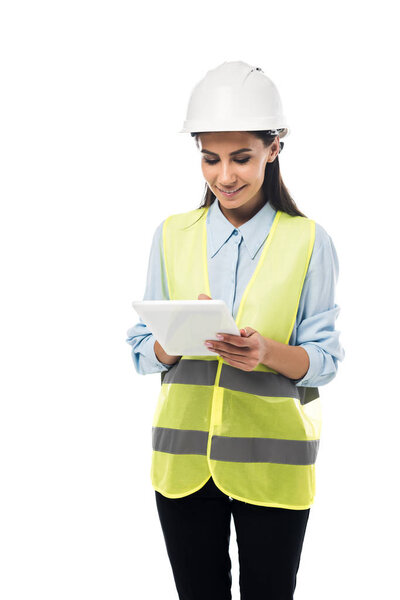Engineer in safety vest using digital tablet isolated on white