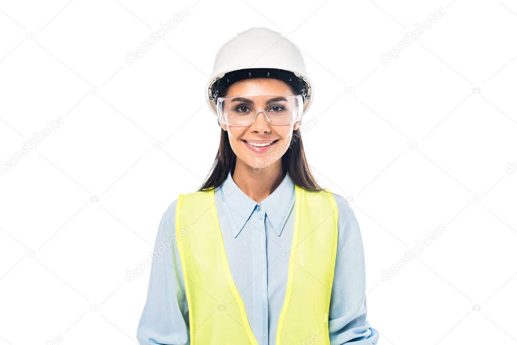 Front view of smiling engineer in hardhat and safety vest isolated on white