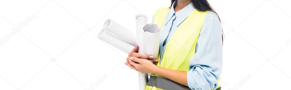 Panoramic shot of engineer in hard hat and goggles holding blueprints isolated on white