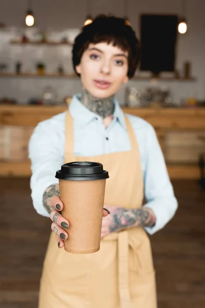 Selective Focus Beautiful Waitress Apron Holding Paper Cup Looking Camera — Stock Photo, Image