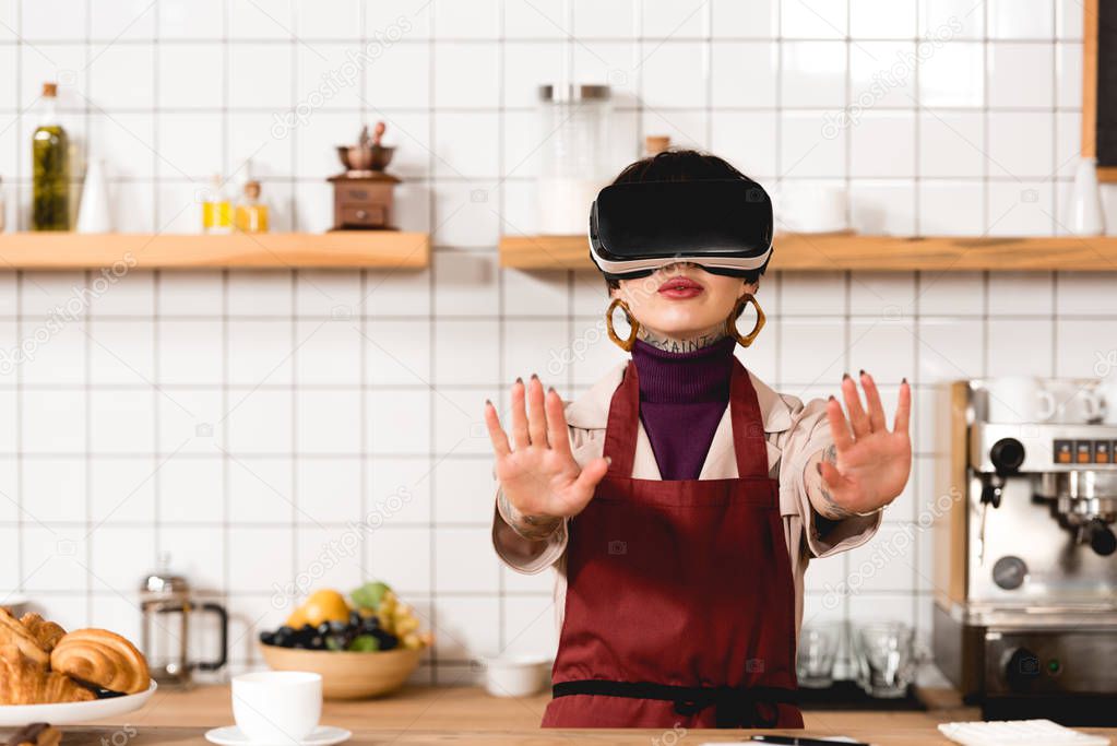 barista in virtual reality headset standing near bar counter in coffee shop
