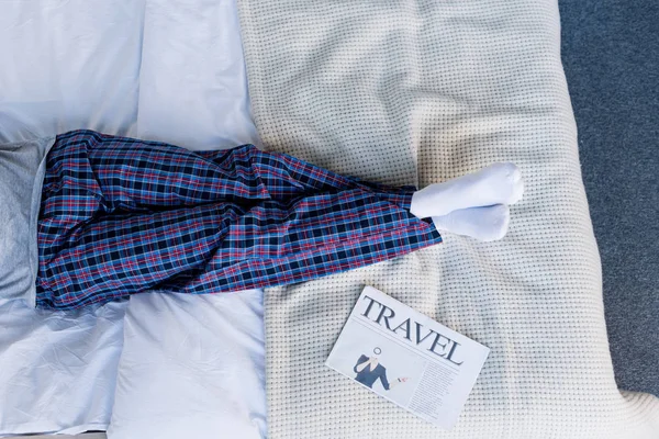 Partial View Man Pyjamas Lying Bed Travel Newspaper — Stock Photo, Image