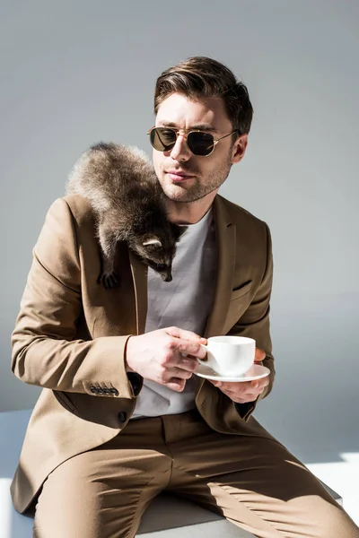 Handsome Man Holding Coffee Cup Cute Raccoon Shoulder — Stock Photo, Image