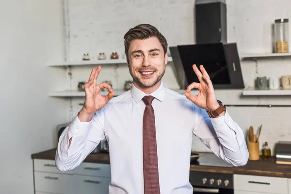 Cheerful Man Standing Kitchen Home Showing Signs — Stock Photo, Image