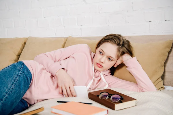 Tired Teenage Kid Lying Bed Books Smartphone — Stock Photo, Image