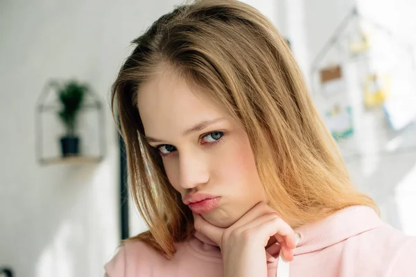 Sad Teenage Kid Pink Hoodie Touching Face Looking Camera — Stock Photo, Image