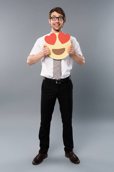 excited businessman holding smiling face with heart-eyes