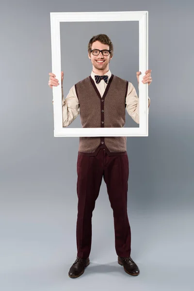 Happy Man Holding White Frame Grey Background — Stock Photo, Image