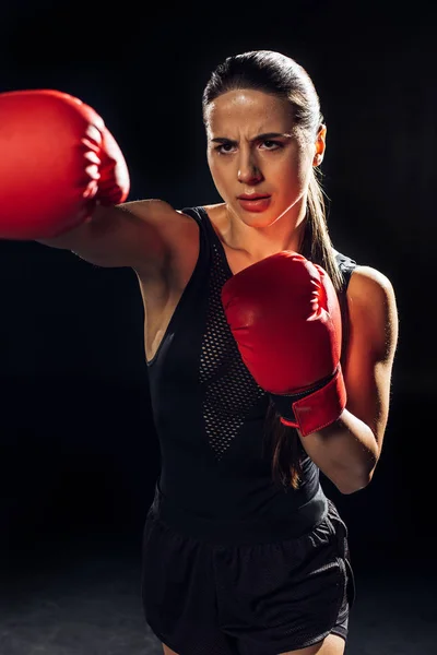 Focused Female Boxer Red Boxing Gloves Training Looking Away Black — Stock Photo, Image