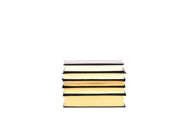 Old black hardcover books with yellow pages isolated on white