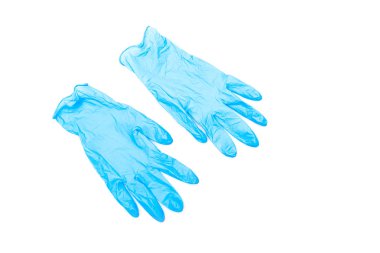 Beyaz yüzeyde izole edilmiş iki mavi kauçuk eldiven