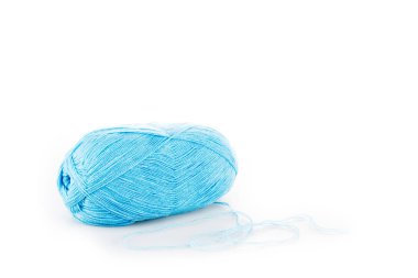 One blue yarn clew on white surface with copy space clipart