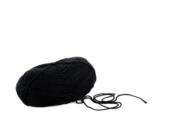 One black yarn clew isolated on white with copy space clipart
