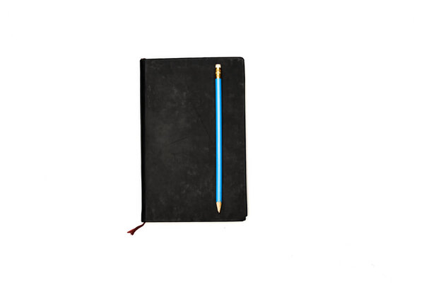 Top view of planner and pencil isolated on white