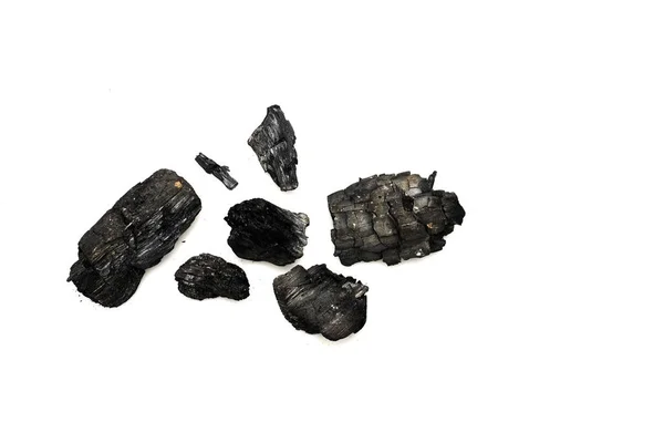 白い上に孤立した黒い焦げた薪の上面図 — ストック写真