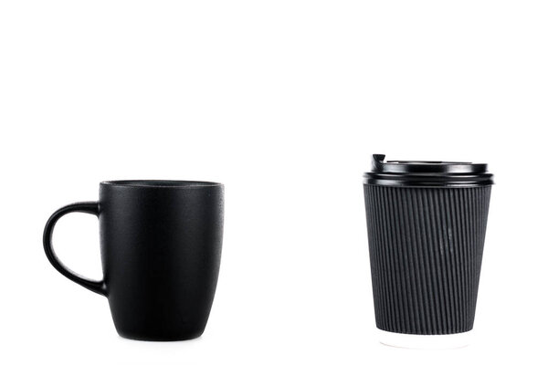 Black ceramic cup and paper cup of coffee isolated on white