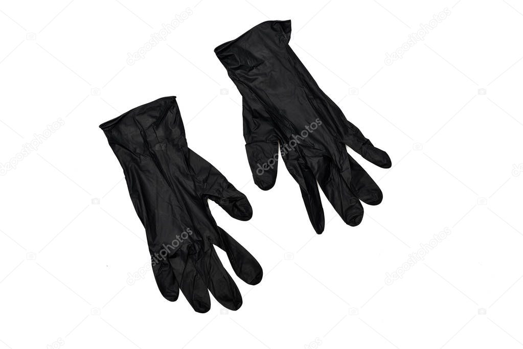 Two black rubber gloves isolated on white surface
