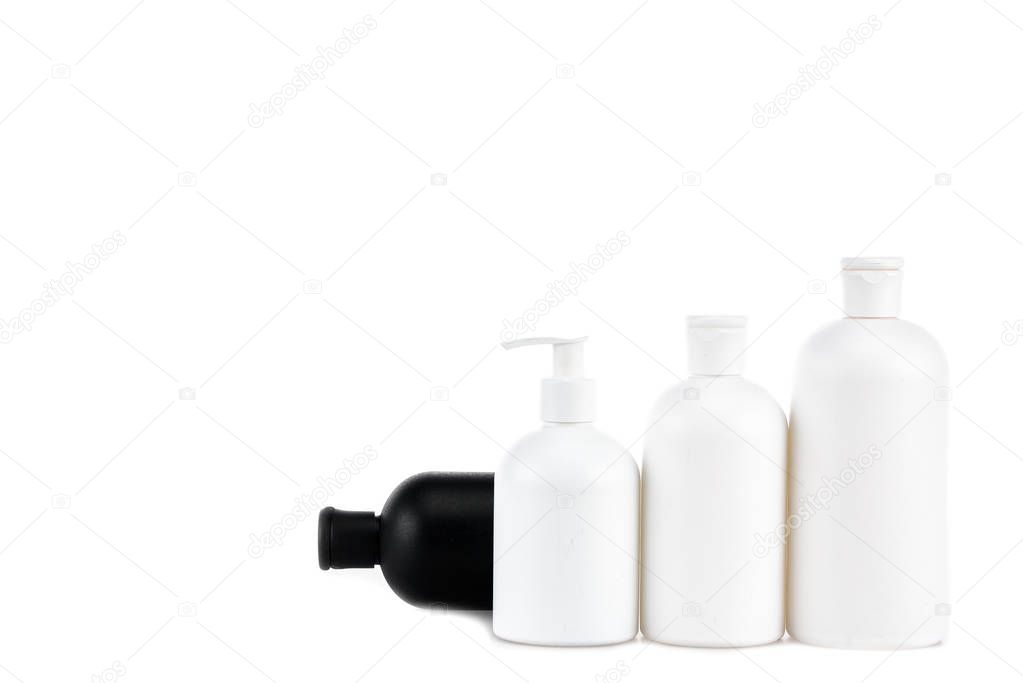 Black and white cosmetic bottles isolated on white