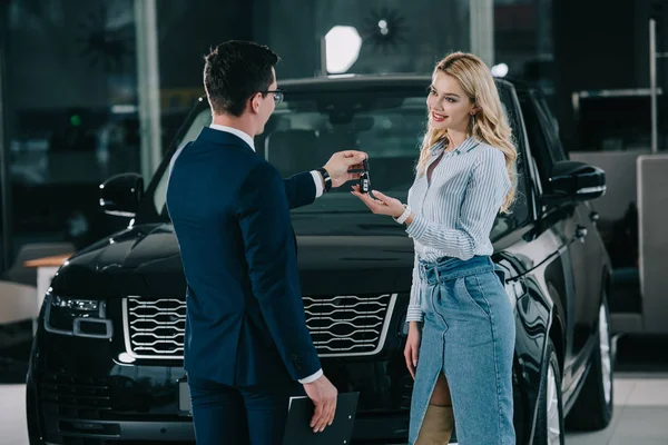 Back View Car Dealer Giving Key Happy Blonde Girl — Stock Photo, Image