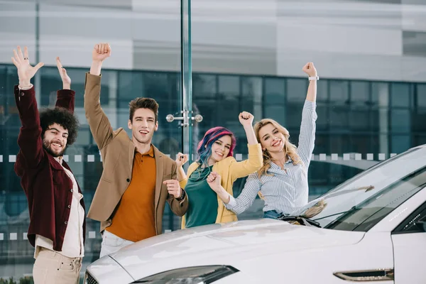 Cheerful Group Friends Standing Hands Head White Car — Stock Photo, Image