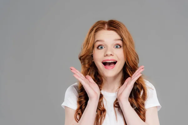 Happy Redhead Girl Looking Camera Gesturing Hands Isolated Grey — Stock Photo, Image