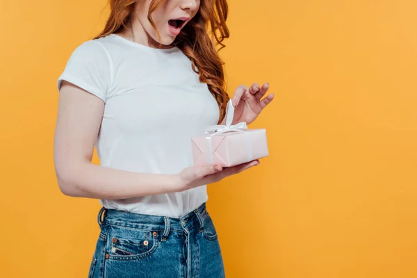 Cropped View Surprised Redhead Girl Holding Gift Box Isolated Yellow — Stock Photo, Image
