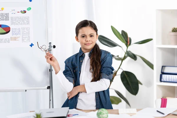 Cute Kid Holding Glasses While Standing White Board Office — Stock Photo, Image