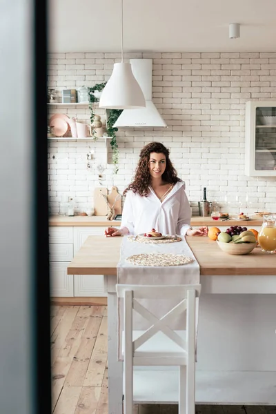 Smiling Young Woman Sitting Table Pancakes Fruits Kitchen — Stock Photo, Image