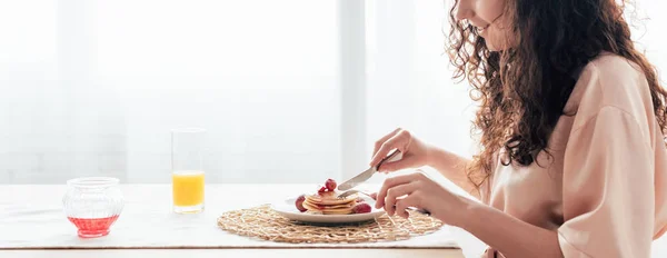 Panoramic Shot Curly Woman Eating Pancakes Kitchen — Stock Photo, Image