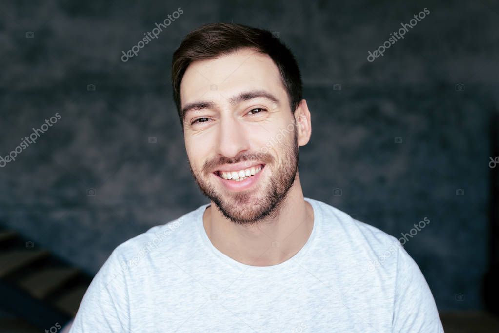 handsome bearded man looking at camera with smile