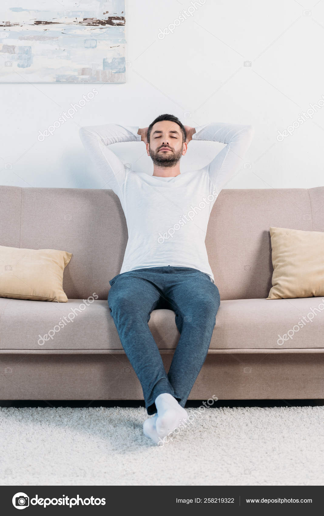 sitting with pillow behind back