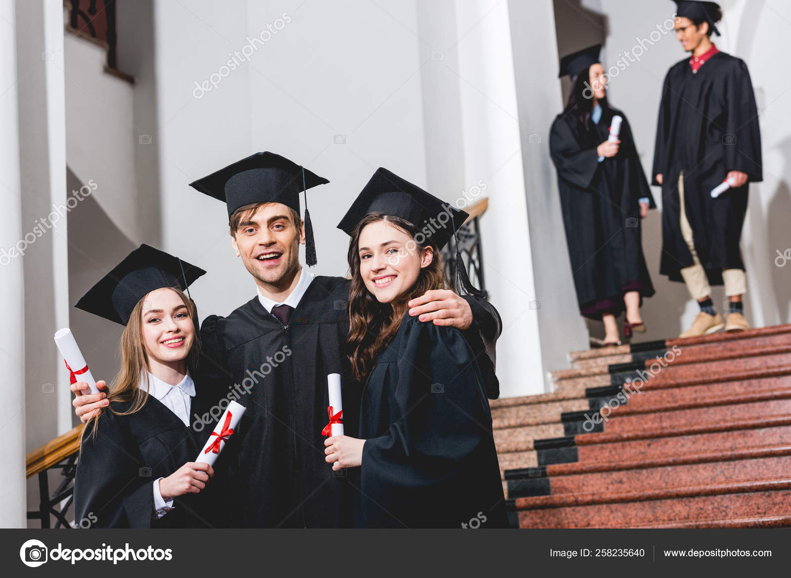 Selective Focus Cheerful Men Graduation Caps Holding Diplomas Students  Stock Photo by ©IgorVetushko 258235138